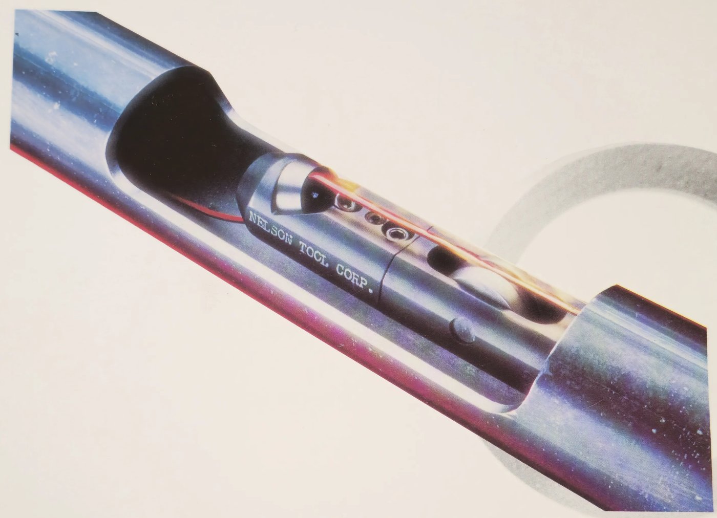 Cutaway of a tube showing a Nelson Tool inside weld bead removal head cutting the I.D. seam